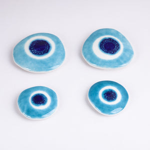 
                
                    Load image into Gallery viewer, Ceramic Pebbles Set with Evil Eye
                
            